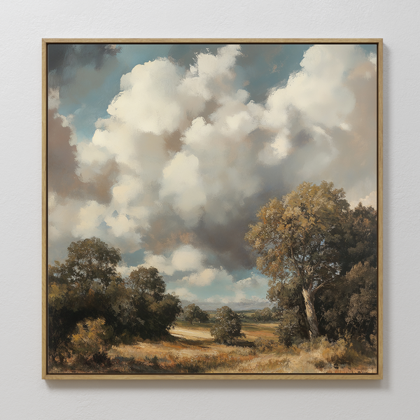 The Gathering Storm Canvas Art features dramatic clouds over a grassy field with trees and bushes, creating striking wall decor thats ideal for displaying in your living room on a white wall.