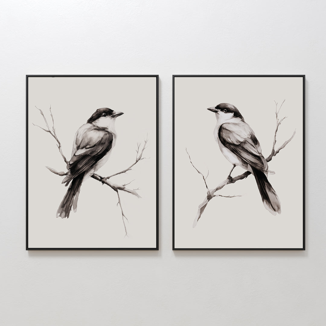 The Still Perch Set of 2 features framed black-and-white prints of birds perched on bare branches, facing right—an elegant, neutral-toned wall art pair ideal for adding a Nordic Park-inspired touch to any space.