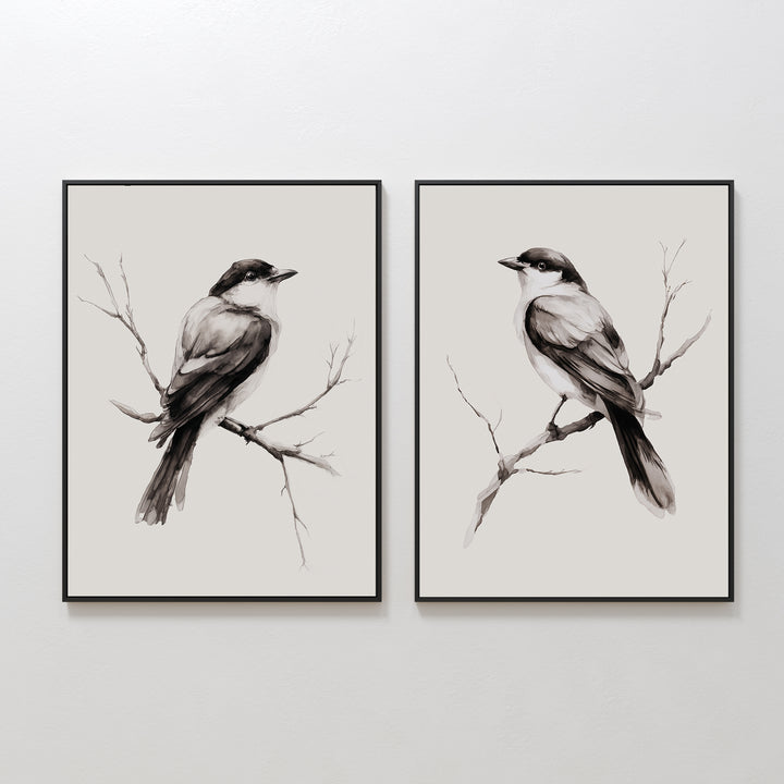 The Still Perch Set of 2 features framed black-and-white prints of birds perched on bare branches, facing right—an elegant, neutral-toned wall art pair ideal for adding a Nordic Park-inspired touch to any space.