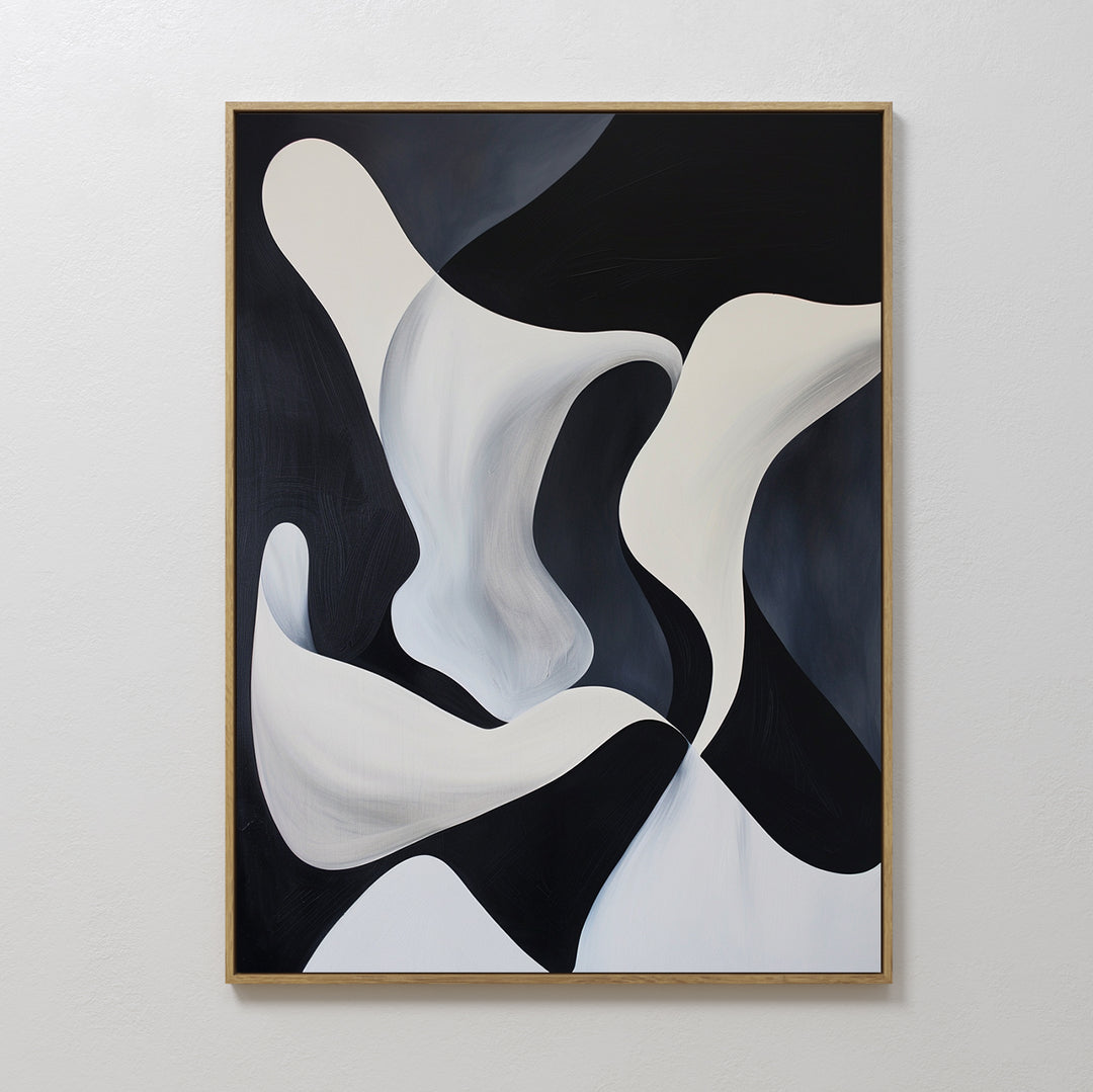 Deep Blue Calm Abstract Canvas Art features flowing curved shapes and smooth gradients in black and white. This minimalist wall art adds movement and depth, making it ideal for modern living room decor within a simple wooden frame on a white wall.