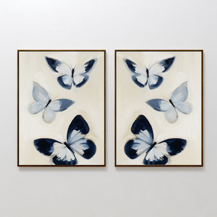 The Midnight Wings Set of 2 features framed wall art with blue and white butterflies and dark accents, hung side by side on a white wall for modern, Nordic Park-inspired decor.