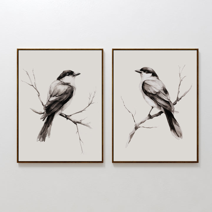 The Still Perch Set of 2 features framed black-and-white bird prints, each showing a bird on a branch facing opposite directions—an elegant Nordic Park accent for your neutral-toned wall art collection.