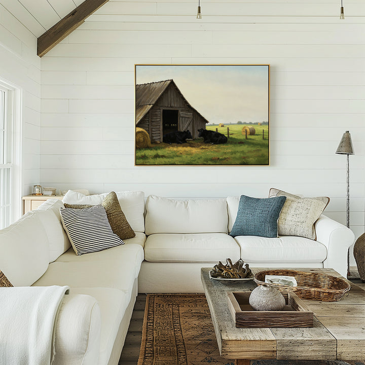 A cozy living room with a white sectional sofa, wooden coffee table, and rustic decor. The Barnside Rest Canvas Art hangs on a white shiplap wall above the couch.