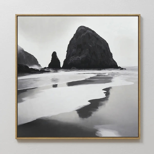 The Basalt Beach Canvas Art is a black-and-white framed painting of rocky sea stacks reflected in wet sand under misty skies—an ideal minimalist coastal decor piece for modern bedroom wall art collections.