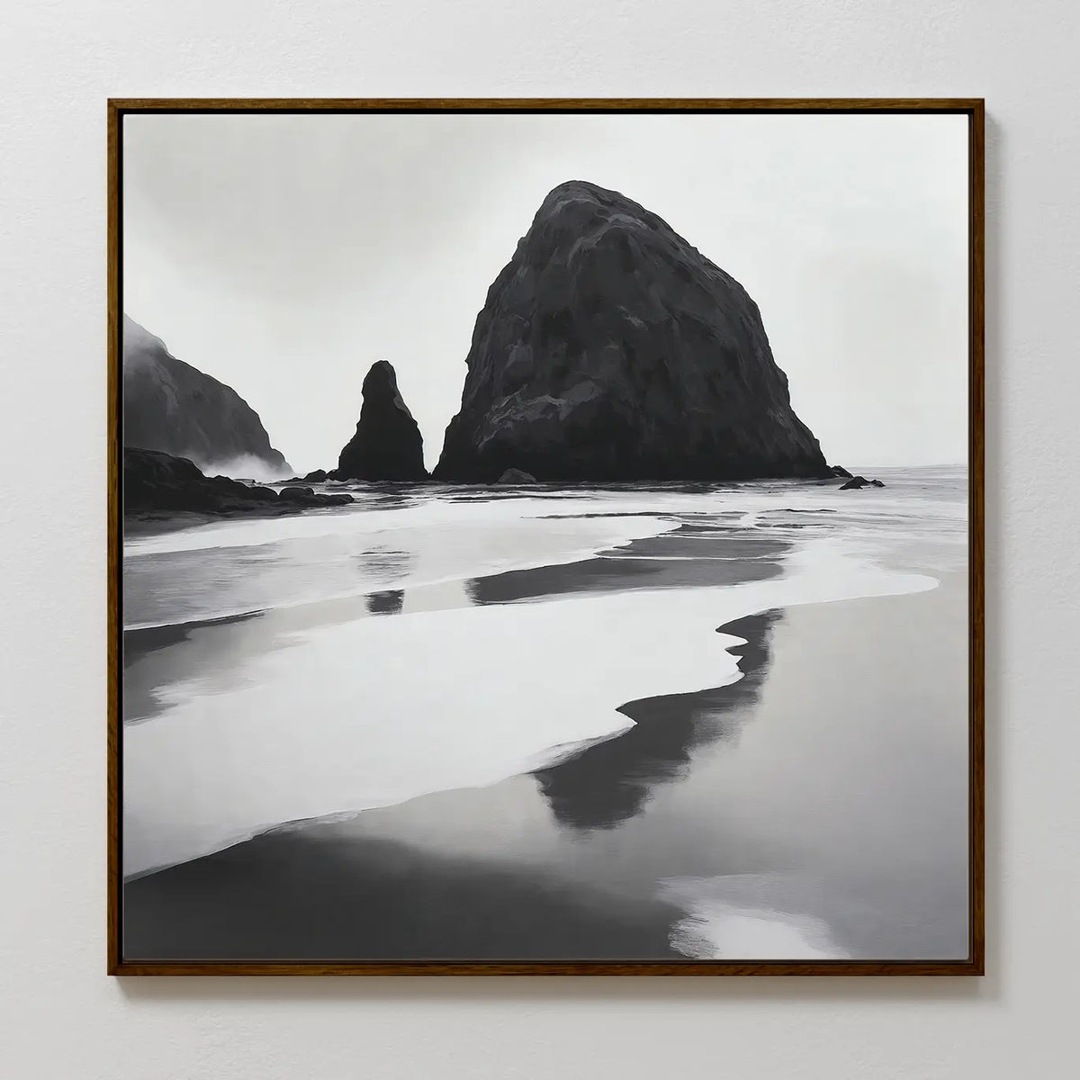 Basalt Beach Canvas Art: A framed black and white coastal scene featuring large sea stacks reflected in wet sand under an overcast sky, perfect as modern wall art for any bedroom.