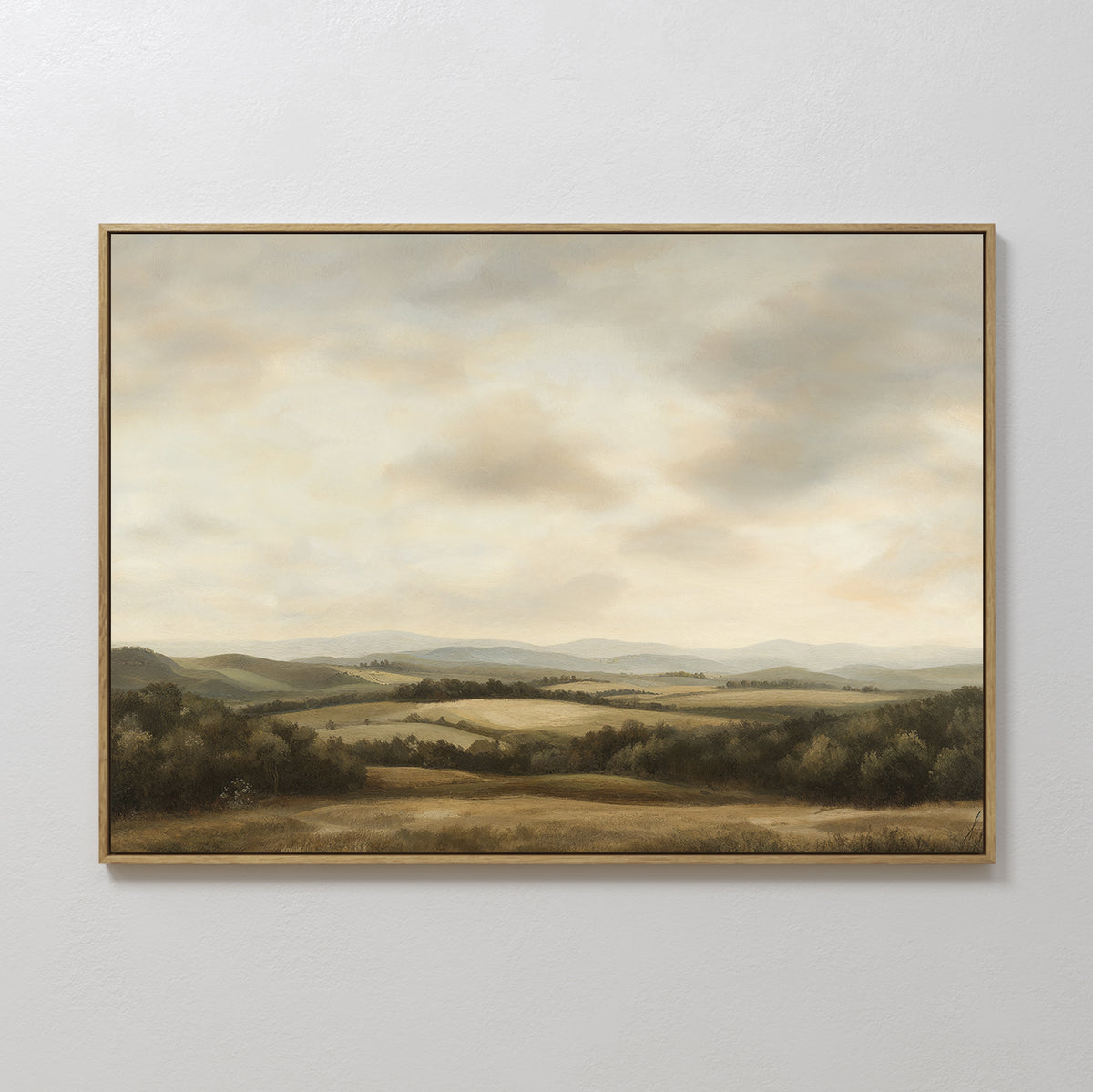 Beneath The Clouds Canvas Art features a serene landscape with rolling hills, fields, and trees beneath a soft, cloudy sky in earthy tones—ideal as minimalist wall art.