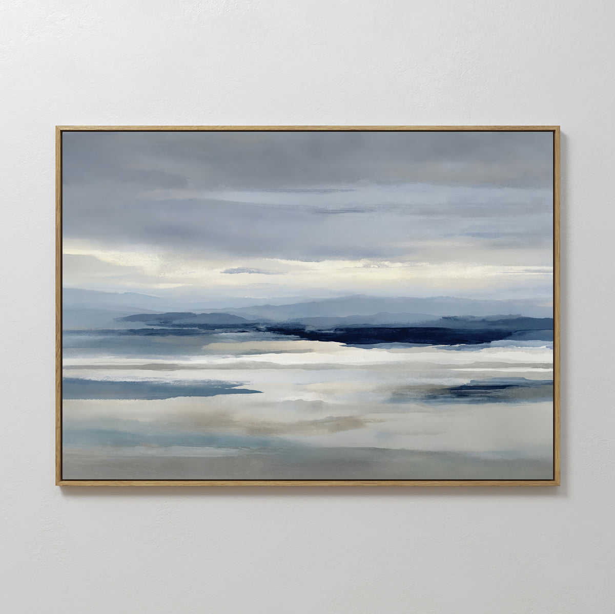 Blue Mist Horizon Canvas Art features a serene landscape of soft blue mountains and reflective water beneath a cloudy sky, rendered in muted tones—perfect minimalist wall art for enhancing your living room decor.