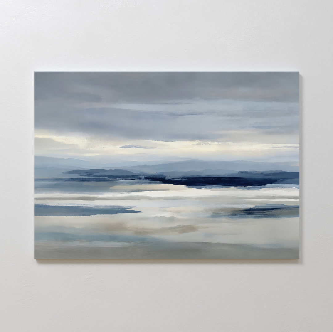 Blue Mist Horizon Canvas Art features soft blue, gray, and white tones with misty mountains and serene water reflections—a perfect minimalist piece to elevate your living room decor.