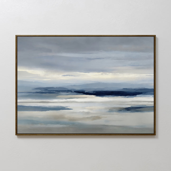 The Blue Mist Horizon Canvas Art features minimalist blue, gray, and white tones in a serene landscape of calm water and distant mountains, creating a tranquil atmosphere perfect for living room decor.