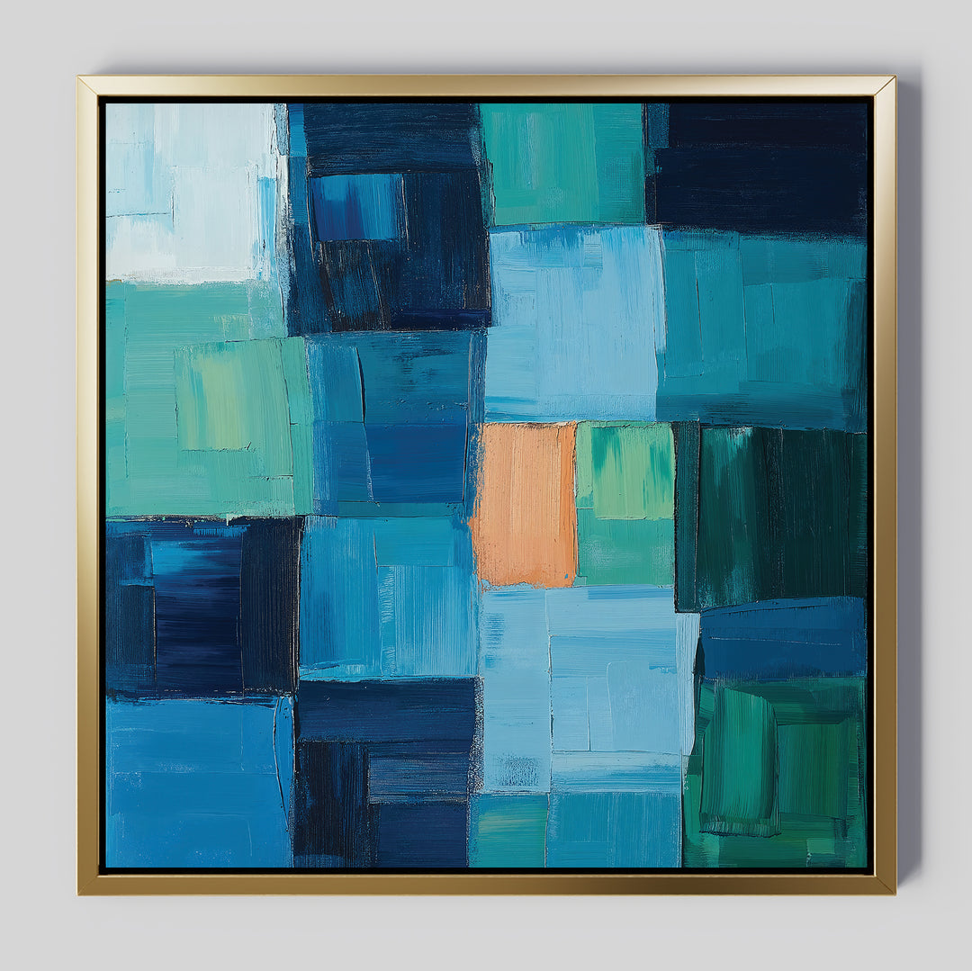 Blue Mosaic Abstract Canvas Art features bold, rectangular blocks in blue, teal, and green with a striking orange accent near the center, all set in a gold frame—an ideal choice for eye-catching living room decor.