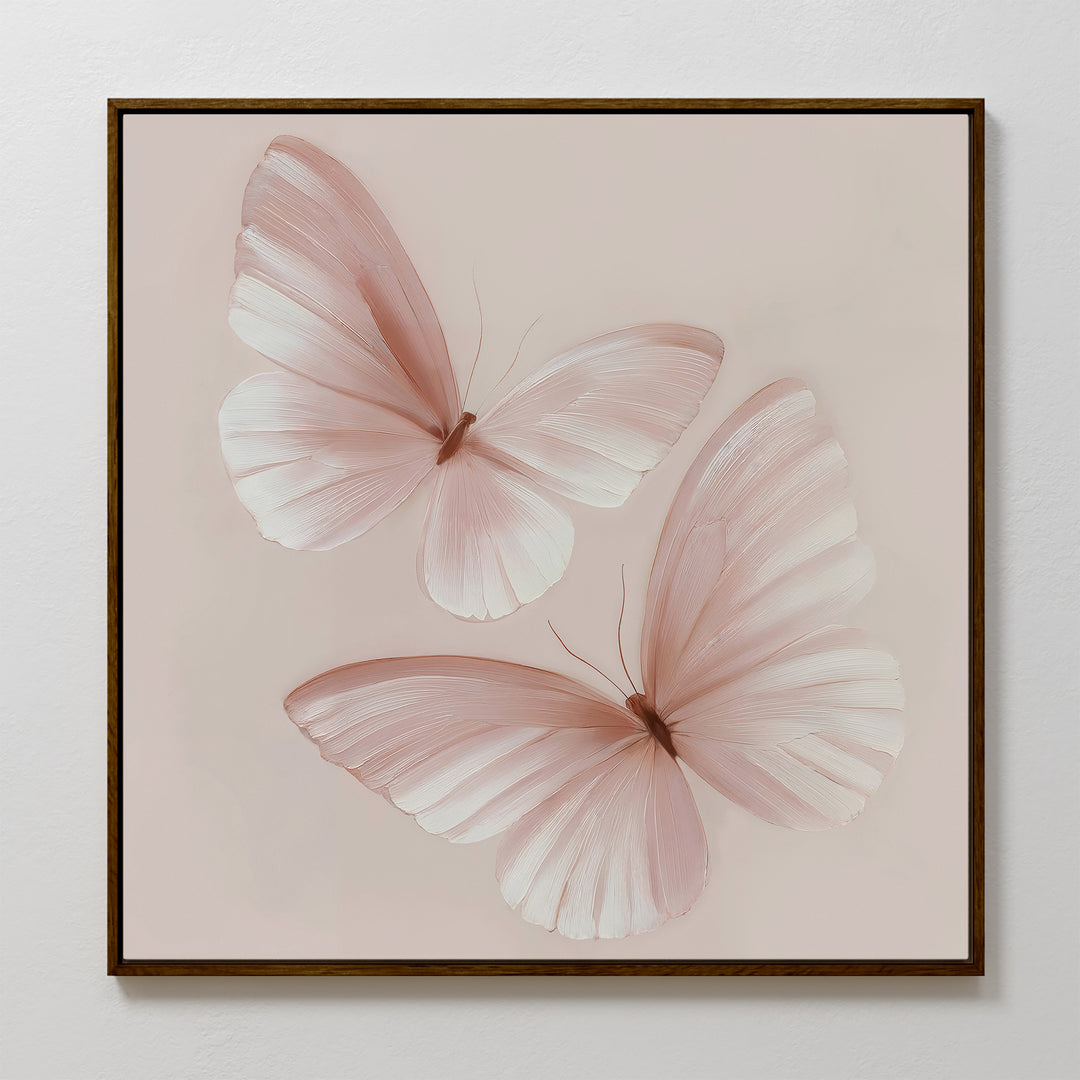 Blush Wings Canvas Art features two pale pink butterflies with delicate, translucent wings on a light beige background—ideal blush pink wall decor for any room.