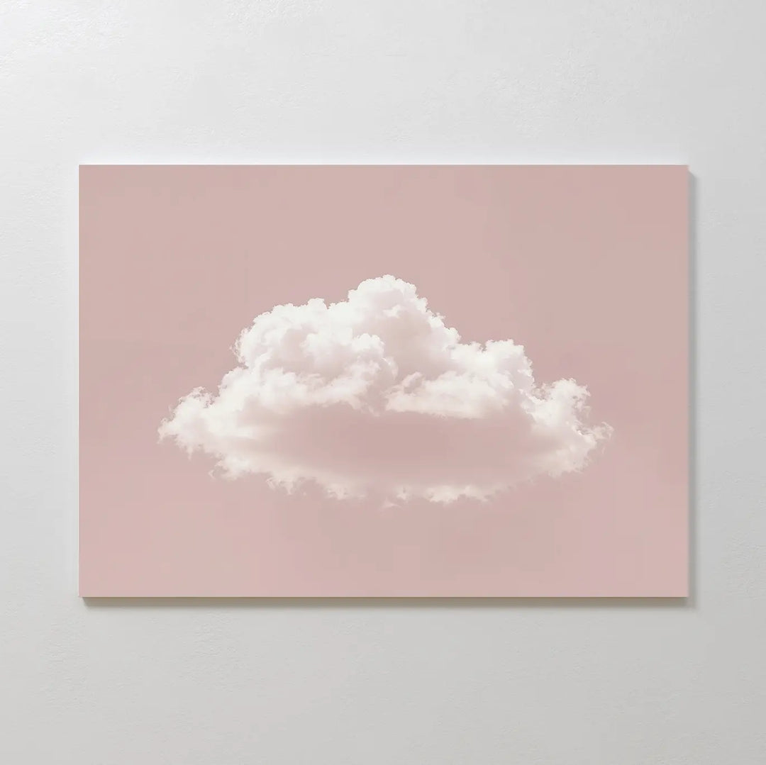 Blushing Sky Canvas Art features a fluffy white cloud on a pastel pink backdrop, centered on a minimalist canvas—ideal as bedroom wall art or a modern statement piece for your minimalist decor.