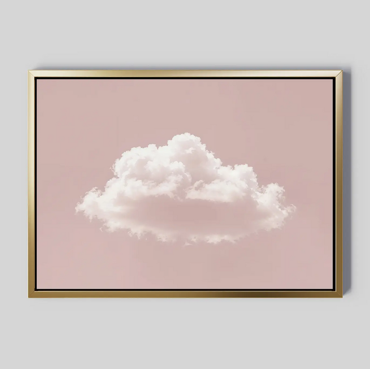 The Blushing Sky Canvas Art features a single fluffy white cloud centered on a soft pink background with a thin gold frame—ideal minimalist decor for any bedroom wall art collection.