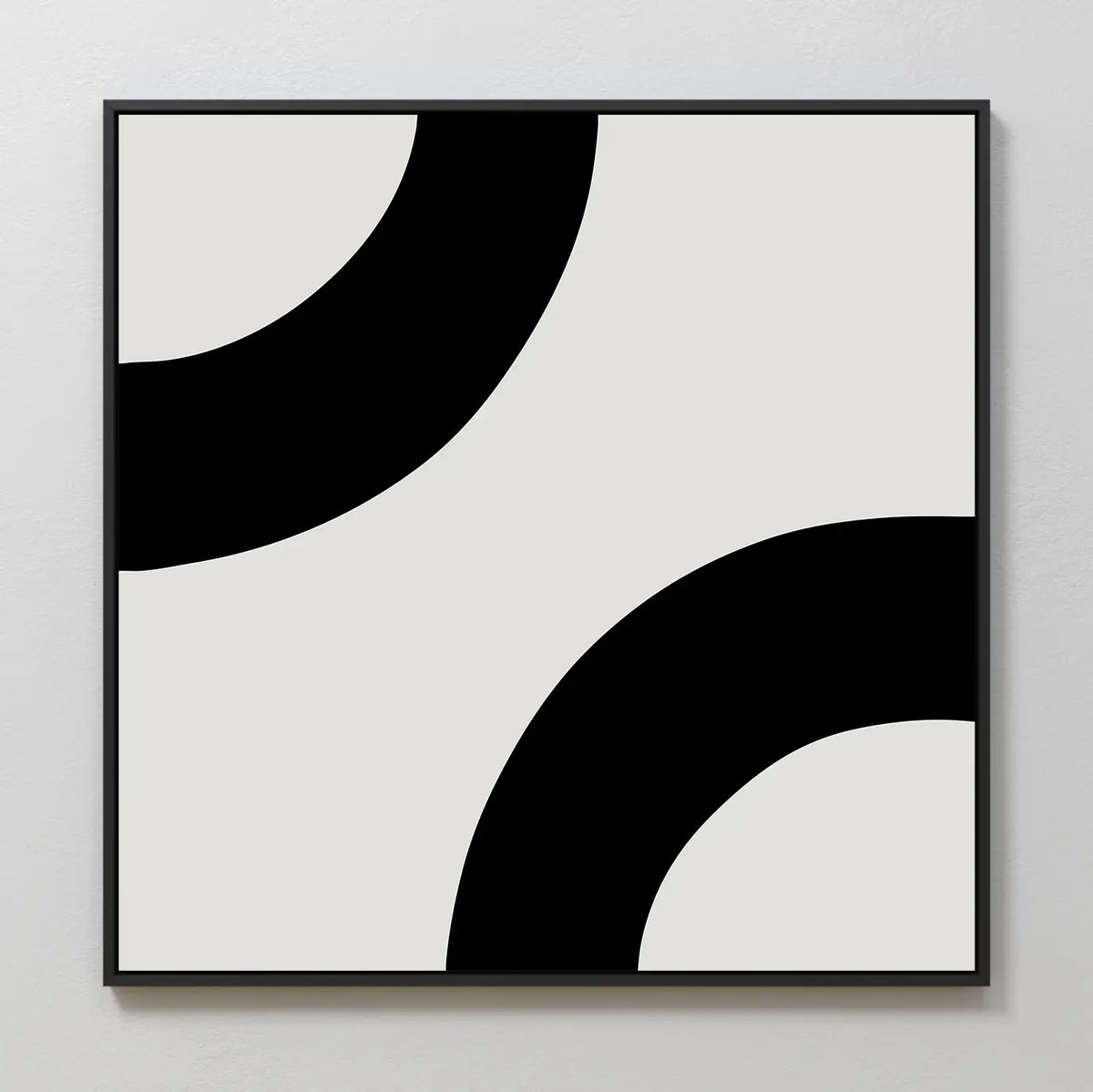 Bold Orbit Canvas Art: This minimalist piece features two thick black curved bands at opposite corners on a light background, framed in black—an ideal abstract wall art choice for modern interiors.