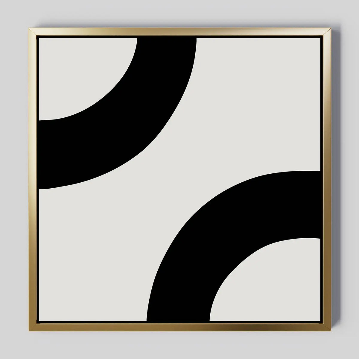 Bold Orbit Canvas Art features two large, thick black curves on a light gray background with a thin gold border. This minimalist wall art print is ideal for enhancing modern interiors with its striking simplicity.