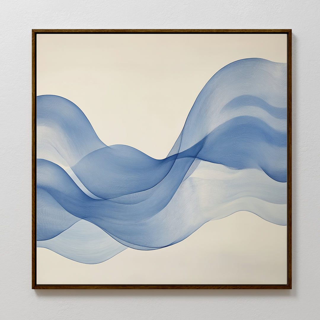 The Calm Swell Canvas Art features flowing blue waves on a cream background, framed in a slim dark brown frame—ideal for adding movement and fluidity to modern living room decor.