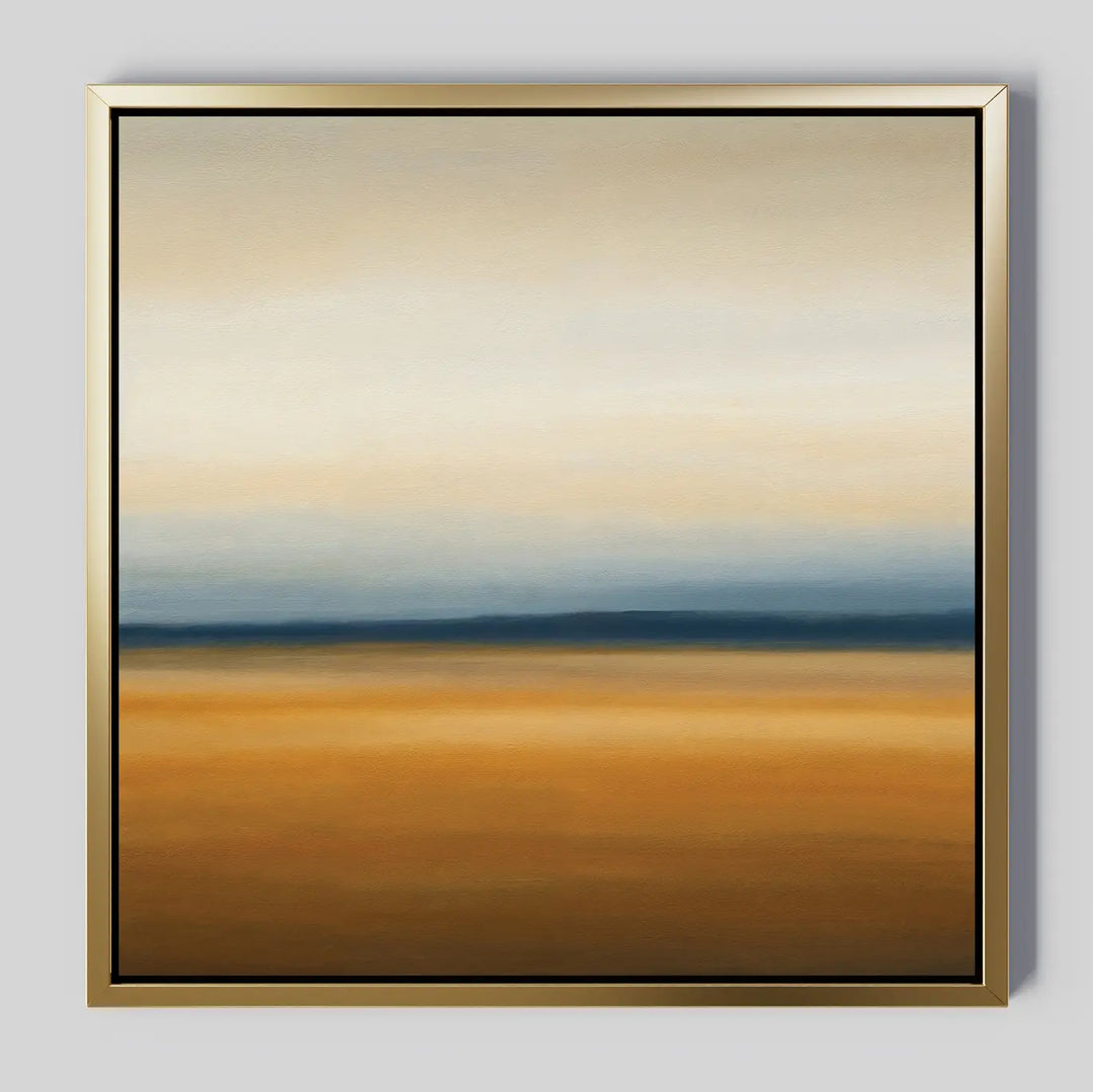 The Caramel Plains Canvas Art is a framed abstract piece with horizontal bands of golden brown, deep blue, and soft beige—evoking a serene horizon and ideal for modern bedroom decor.