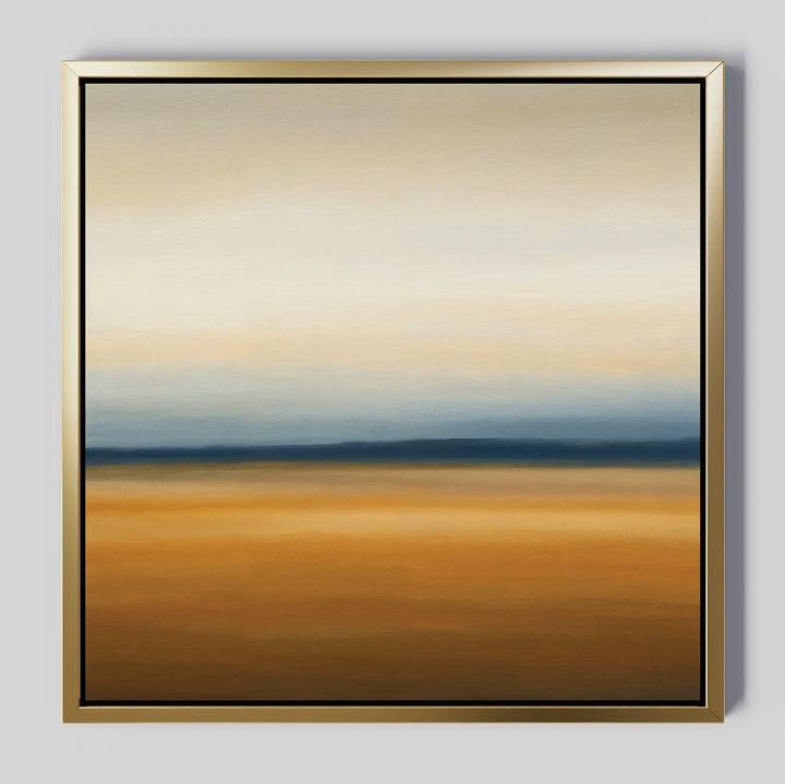The Caramel Plains Canvas Art is a framed abstract piece with horizontal bands of golden brown, deep blue, and soft beige—evoking a serene horizon and ideal for modern bedroom decor.
