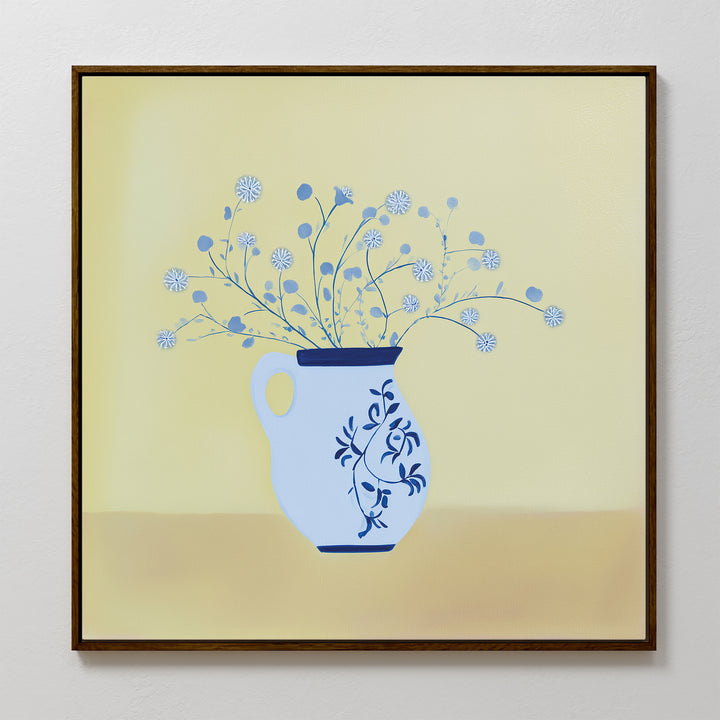 The Cerulean Petals Canvas Art features a vase with delicate blue petals and thin stems on a soft yellow background—ideal for minimalist wall decor.