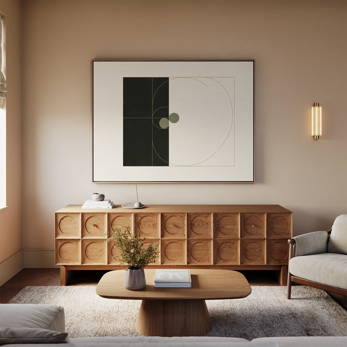 A modern living room with beige walls, a wooden sideboard, a plush rug, a lighted wall sconce, a coffee table with flowers, and the Circular Tension Canvas Art as minimalist decor creates warm, cozy modern living room style.