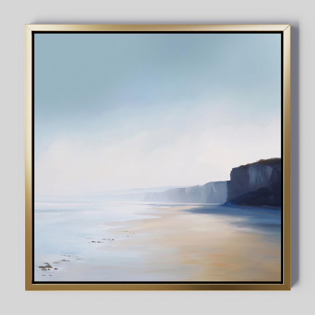 Cliffside Light Canvas Art features a serene coastal scene with sandy beach, gentle waves, distant cliffs, and a soft blue-beige sky—perfect minimalist wall art for any space.
