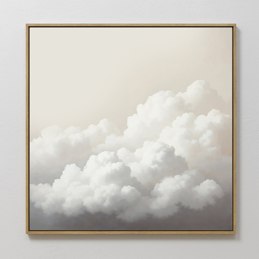 Cloud Reverie Canvas Art features fluffy white clouds on a pale sky, framed with thin wood for a minimalist look. This calming wall art is perfect as serene bedroom decor or for adding peace to any simple white wall.