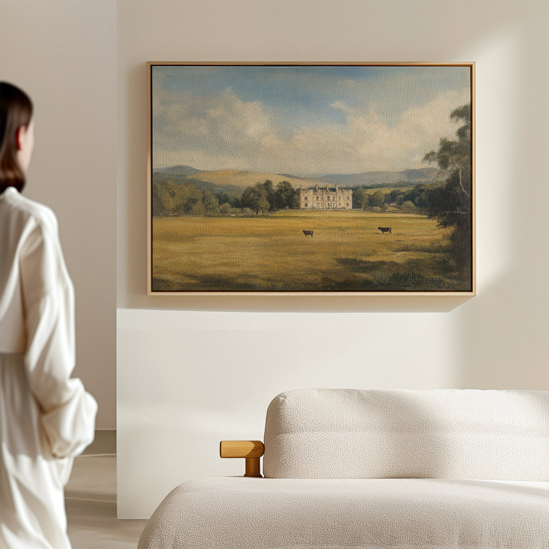 A woman admires the Countryside Dream Canvas Art displayed on a wall.