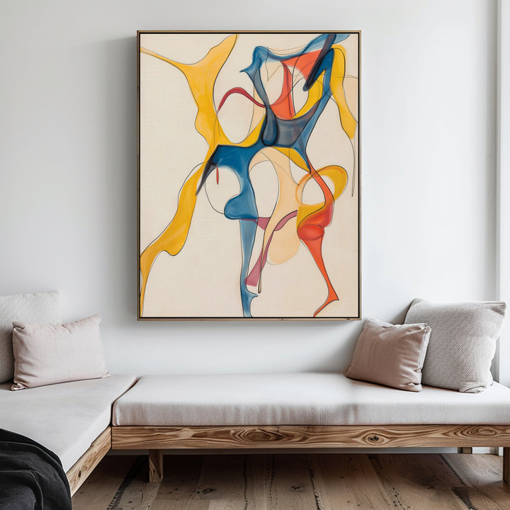 A modern living room with a light wooden daybed, beige cushions, and the Dance Of Unity Abstract Canvas Art—featuring flowing blue, yellow, and red shapes—creates stylish decor for any contemporary space.