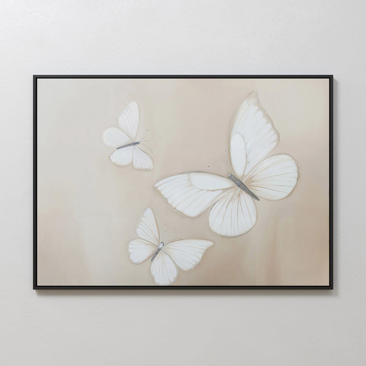 Delicate Whites Canvas Art features three white butterflies with delicate wings on a soft beige background, creating calm, minimalist wall decor perfect for a neutral space.