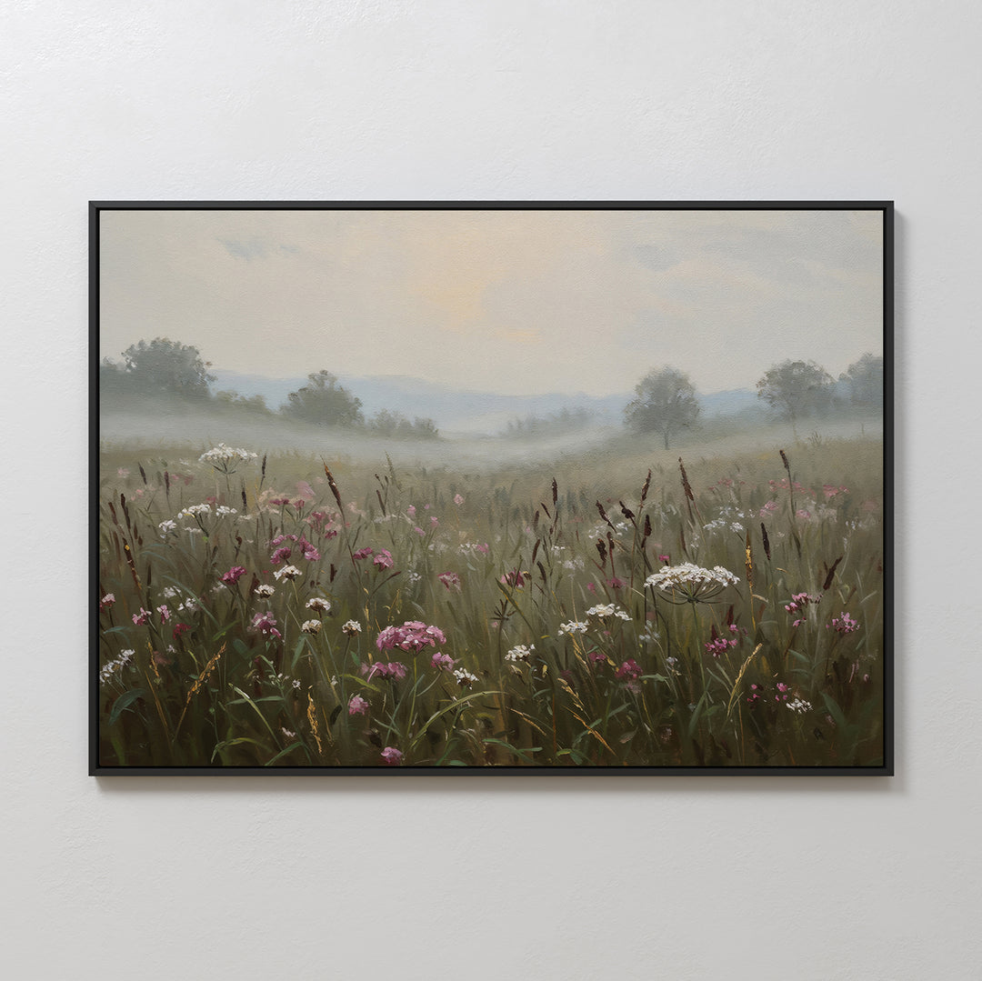 Add a tranquil touch to your space with the Distant Fields Canvas Art, a framed painting of a misty meadow with wildflowers and tall grasses in soft, muted colors beneath a pale sky and distant trees.