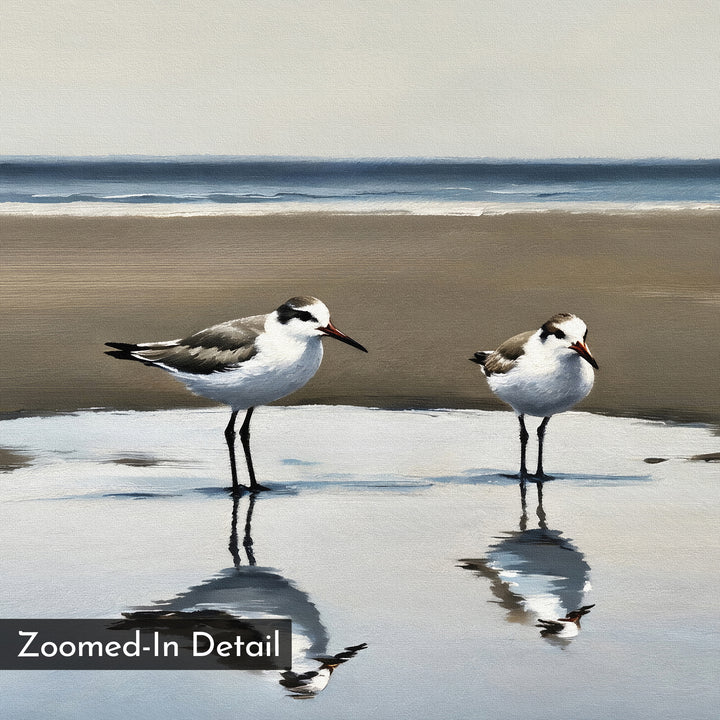 Two seagulls stand in shallow beach water, their reflections shimmering on wet sand beneath a tranquil sea and muted sky. This striking minimalist piece, titled Drifted Calm Canvas Art, features a "Zoomed-In Detail" label in the lower left corner.