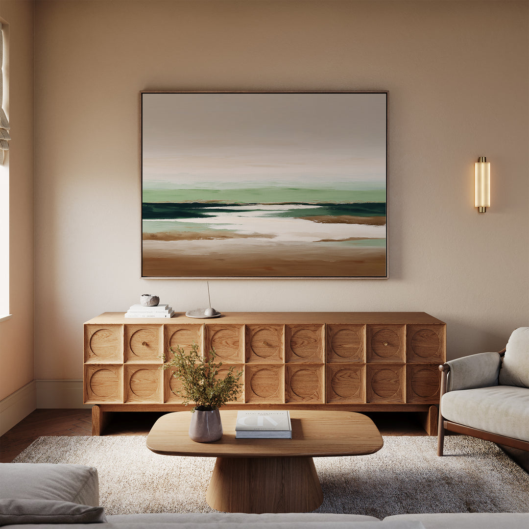 A modern living room with a light wooden sideboard, low coffee table with a vase of flowers, beige sofa, and the Earthbound Horizon Canvas Art as striking abstract wall decor above the sideboard. Warm neutral tones define the space.