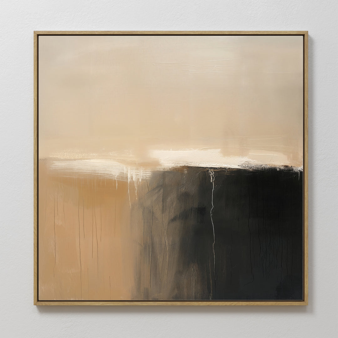 Earthy Cliffs Abstract Canvas Art features soft beige and tan tones above, blending into dark brown and black shades at the bottom right. White streaks add movement. Framed in a thin gold frame, its perfect minimalist wall art for your living room decor.