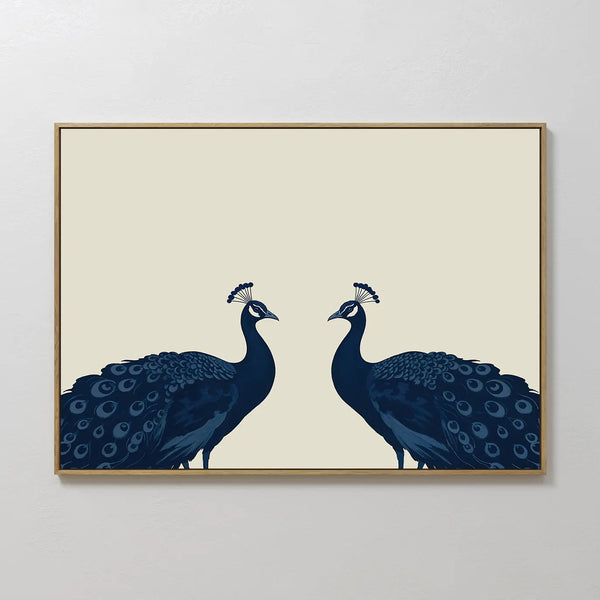 Elegant Plumage Canvas Art showcases two dark blue peacocks facing each other on a light beige background, with detailed feathers and crests—perfect for adding a striking, minimalist touch to your living room decor.