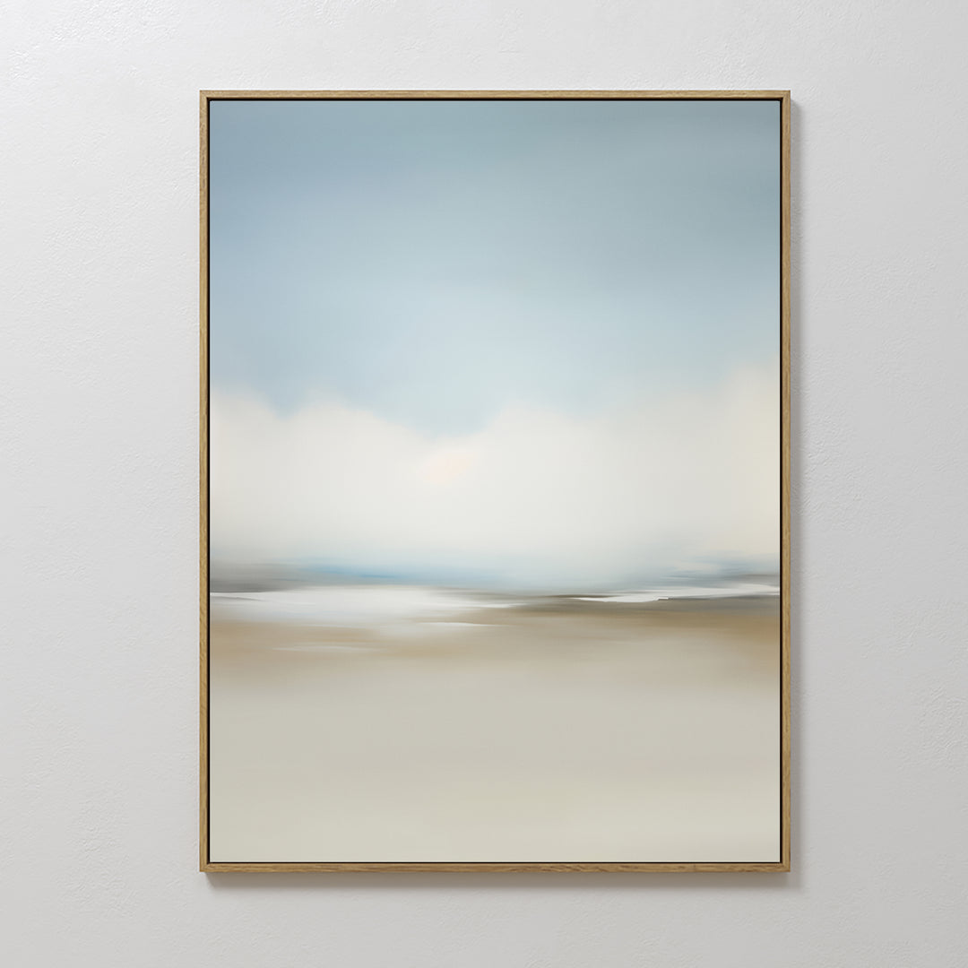 Faded Silence Canvas Art features soft, blurred blue, white, and beige tones suggesting a serene minimalist landscape. This framed abstract piece adds calm elegance to any plain white wall.