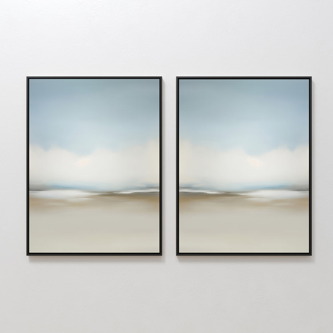 The Faded Silence Set of 2 features abstract wall art with soft, blurred beige, blue, and white tones. These framed pieces create a serene landscape look—ideal minimalist decor for modern spaces when hung side by side on a white wall.