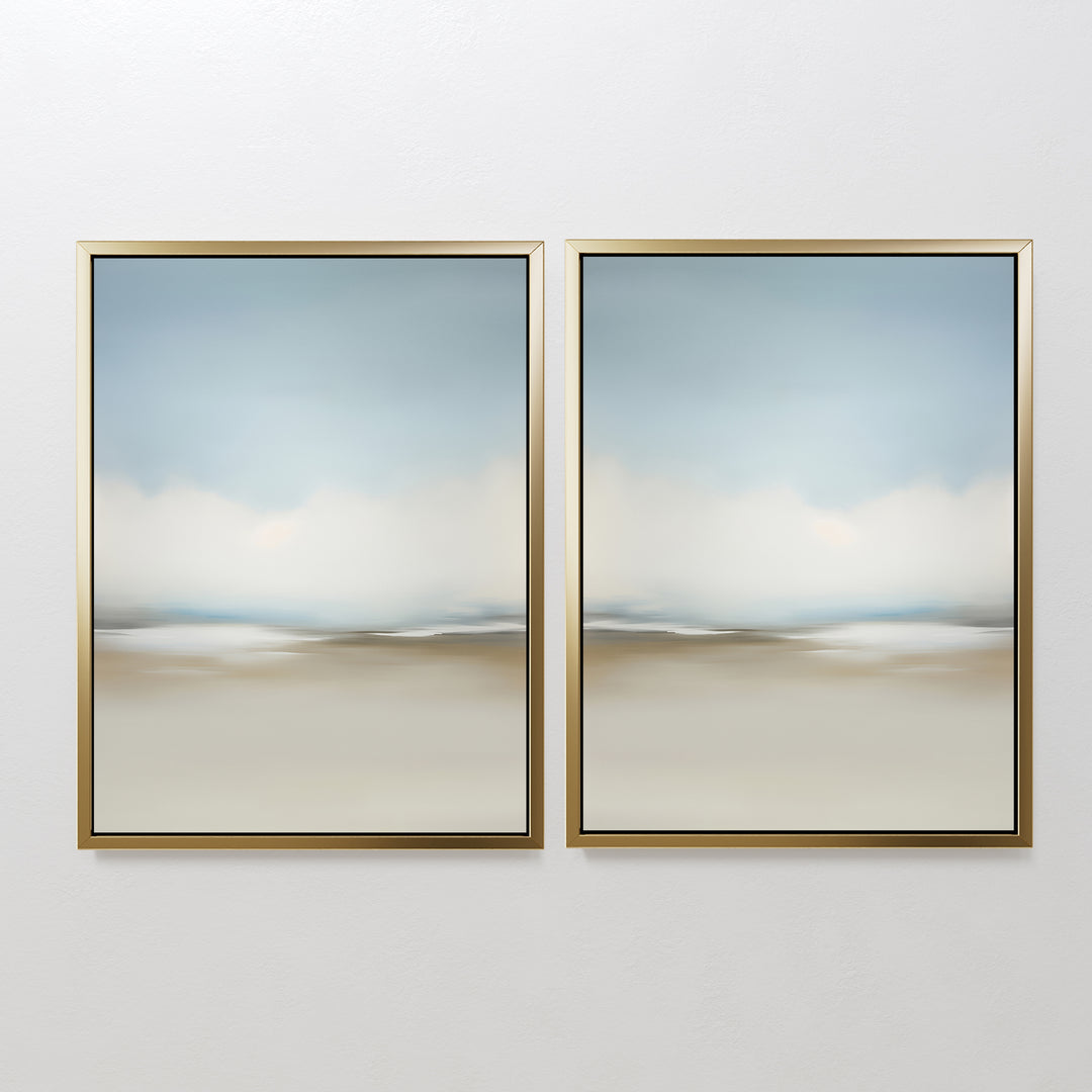 The Faded Silence Set of 2 features abstract landscape prints in soft blue, white, and beige tones, evoking a tranquil, cloudy sky—ideal minimalist wall art displayed together on a white wall.