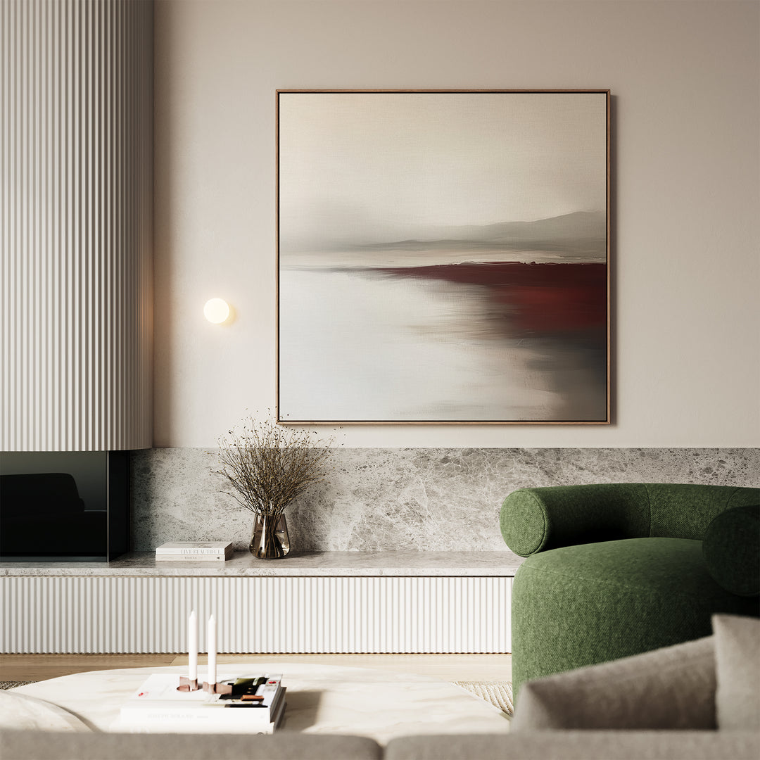 A modern living room with a green armchair, marble-top console, dried branches in a vase, and the Fading Light Canvas Art—minimalist abstract landscape wall art in neutral and red tones—creates a softly lit, minimalistic decor.