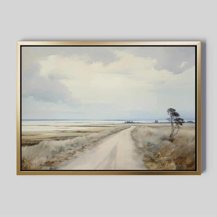 Far Light Canvas Art: A framed painting of a rural landscape with a dirt road, grassy fields, sparse trees, and a broad cloudy sky—an ideal choice for minimalist decor in any space.
