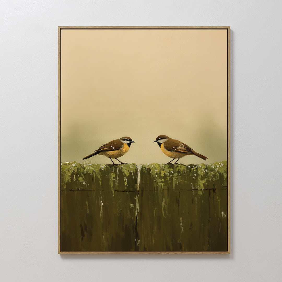 Fence Companions Canvas Art displays two small brown birds with white and yellow markings perched on a mossy green fence, set against a soft beige background—perfect for adding Nordic Park charm to rustic bedroom decor.