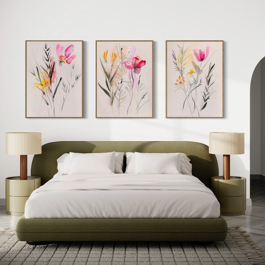 A modern bedroom features a green upholstered bed, white bedding, beige nightstands with matching lamps, and the Floral Harmony Set of 3 above the bed for a fresh touch.