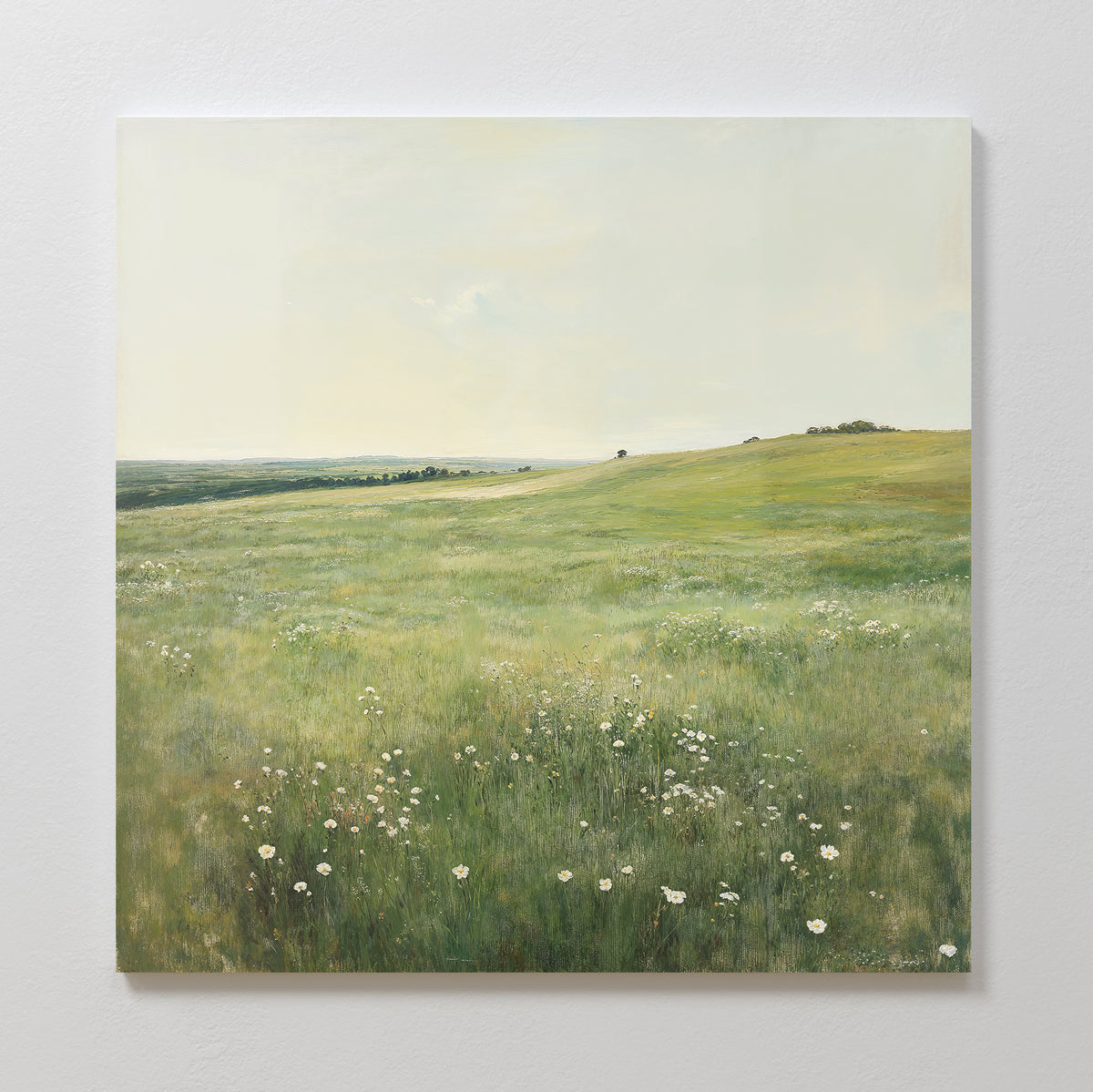 The Floral Meadow Canvas Art features a green meadow with wildflowers beneath a pale sky, gentle hills, and scattered trees—ideal wall decor to bring nature’s beauty into your living room.