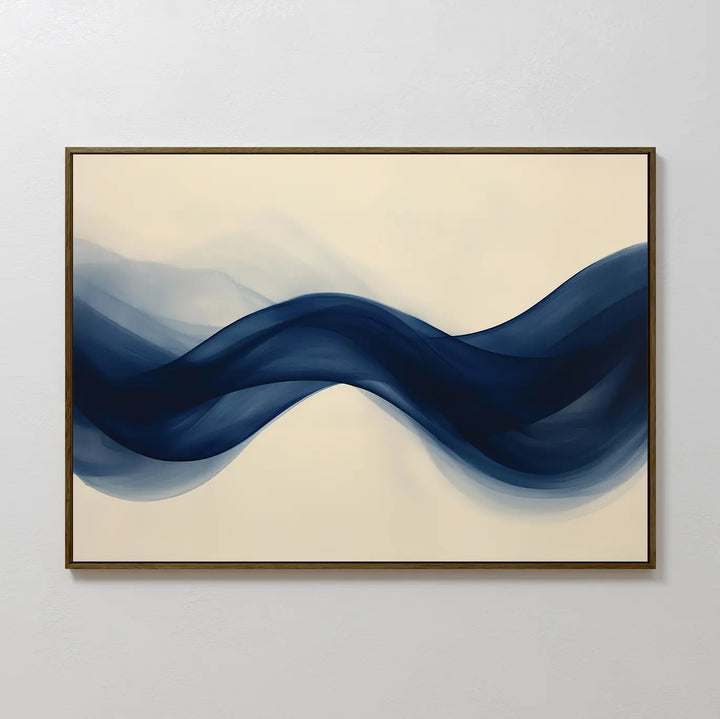 Flowing Indigo Canvas Art features wave-like shapes in deep blue on a light beige background, framed with a dark border—ideal modern wall art to elevate minimalist interiors or enhance your living room decor.