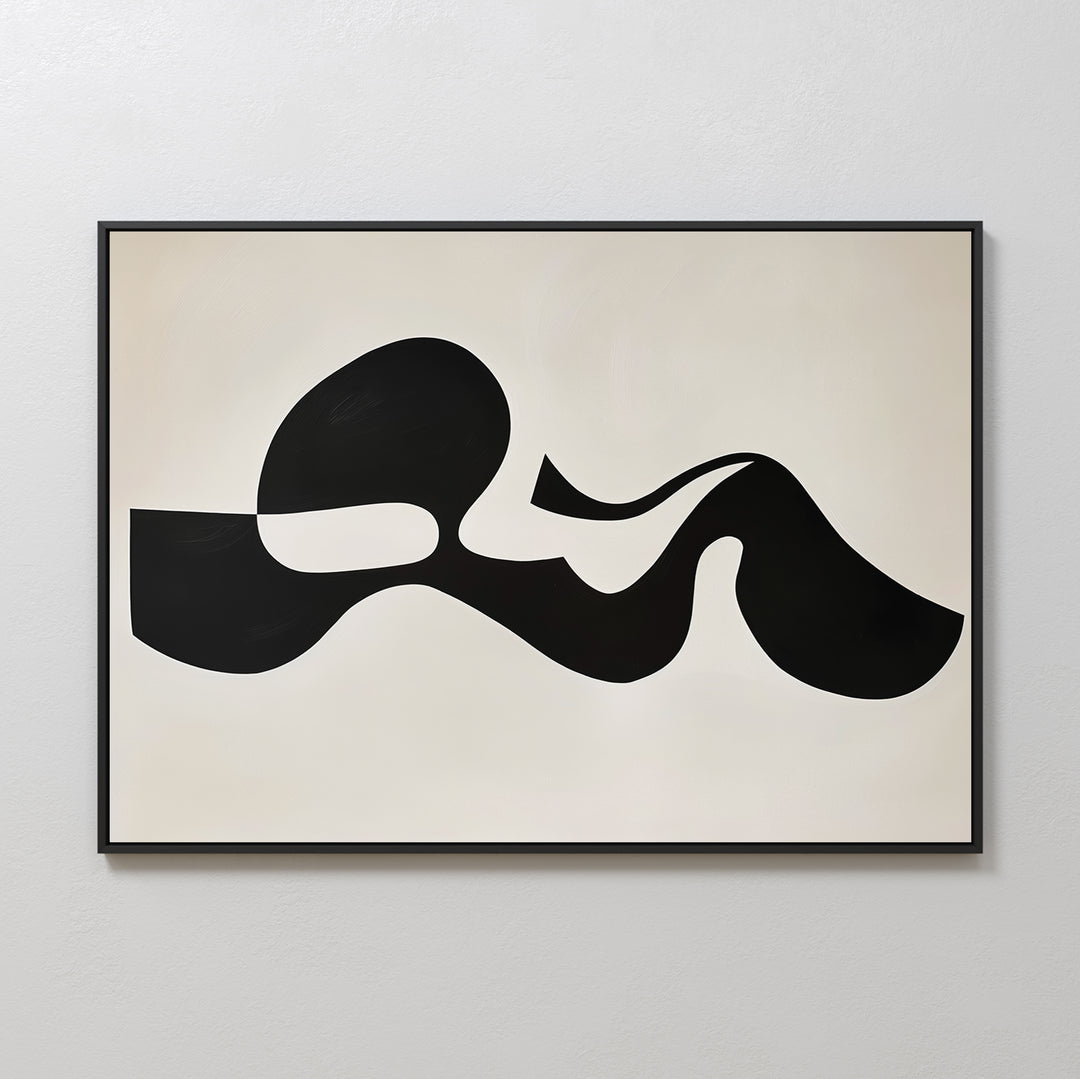 The Fluid Forms Abstract Canvas Art showcases bold black organic shapes on a light beige backdrop, framed in sleek black—an ideal minimalist piece for modern wall décor.