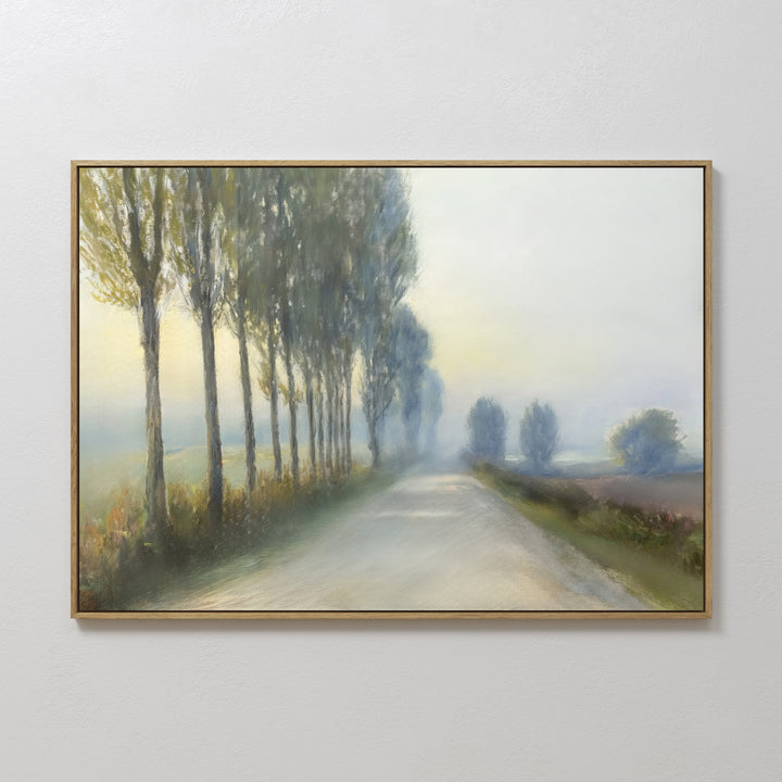 Forest Haze Canvas Art: A framed minimalist wall art of a country road lined with tall trees, fading into a misty distance under a hazy sky. Its soft, muted colors make it a tranquil accent for any space.