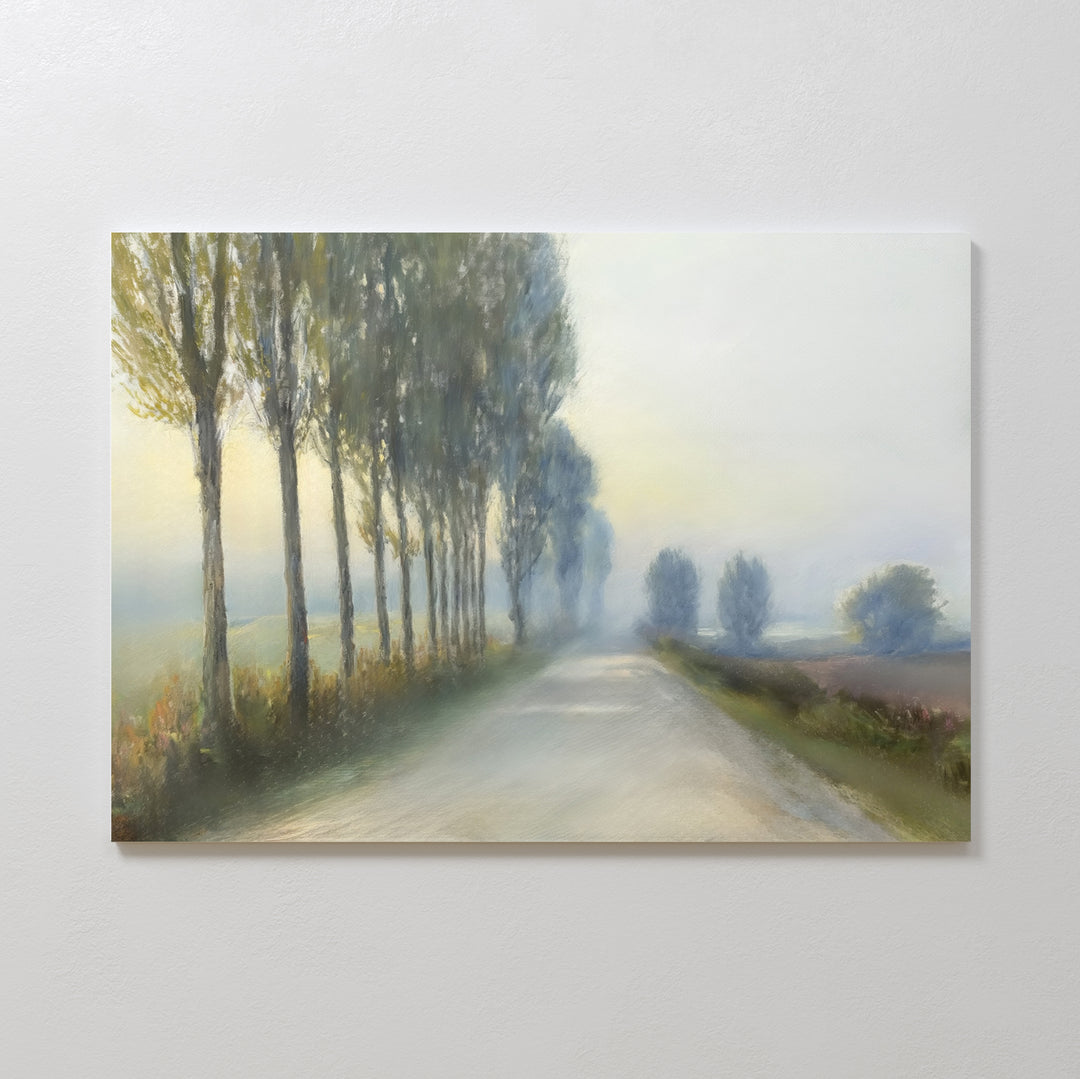 Forest Haze Canvas Art features a tranquil country road bordered by tall trees, fading into a misty landscape—perfect wall decor that adds minimalist beauty and subtle greenery to any space.