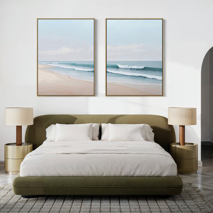 A modern bedroom features a green bed, white bedding, and gold nightstands with the Gentle Surf Set of 2 coastal wall art above the bed. Neutral decor and beach-inspired touches create a serene, minimalist space.