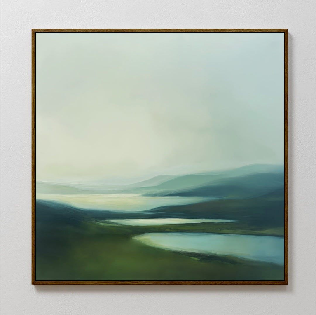 Gentle Valleys Abstract Canvas Art features soft green hills and blue water beneath a pale sky—serene wall decor that brings calm to your living room.