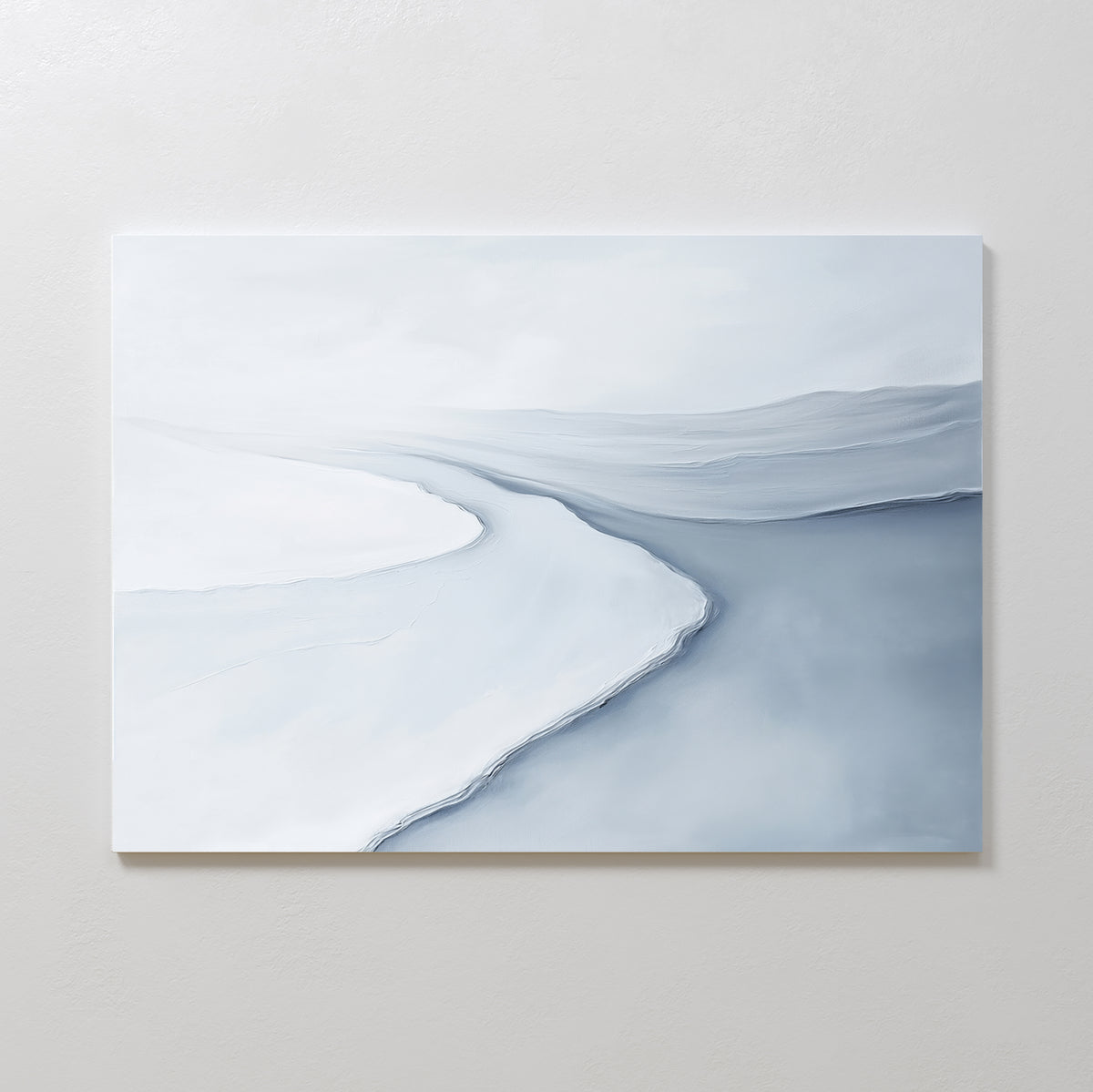 Glacial Flow Canvas Art – Horizontal features a minimalist abstract design in cool gray and white tones, evoking a curving river or shoreline—ideal for adding modern elegance to your living room decor.