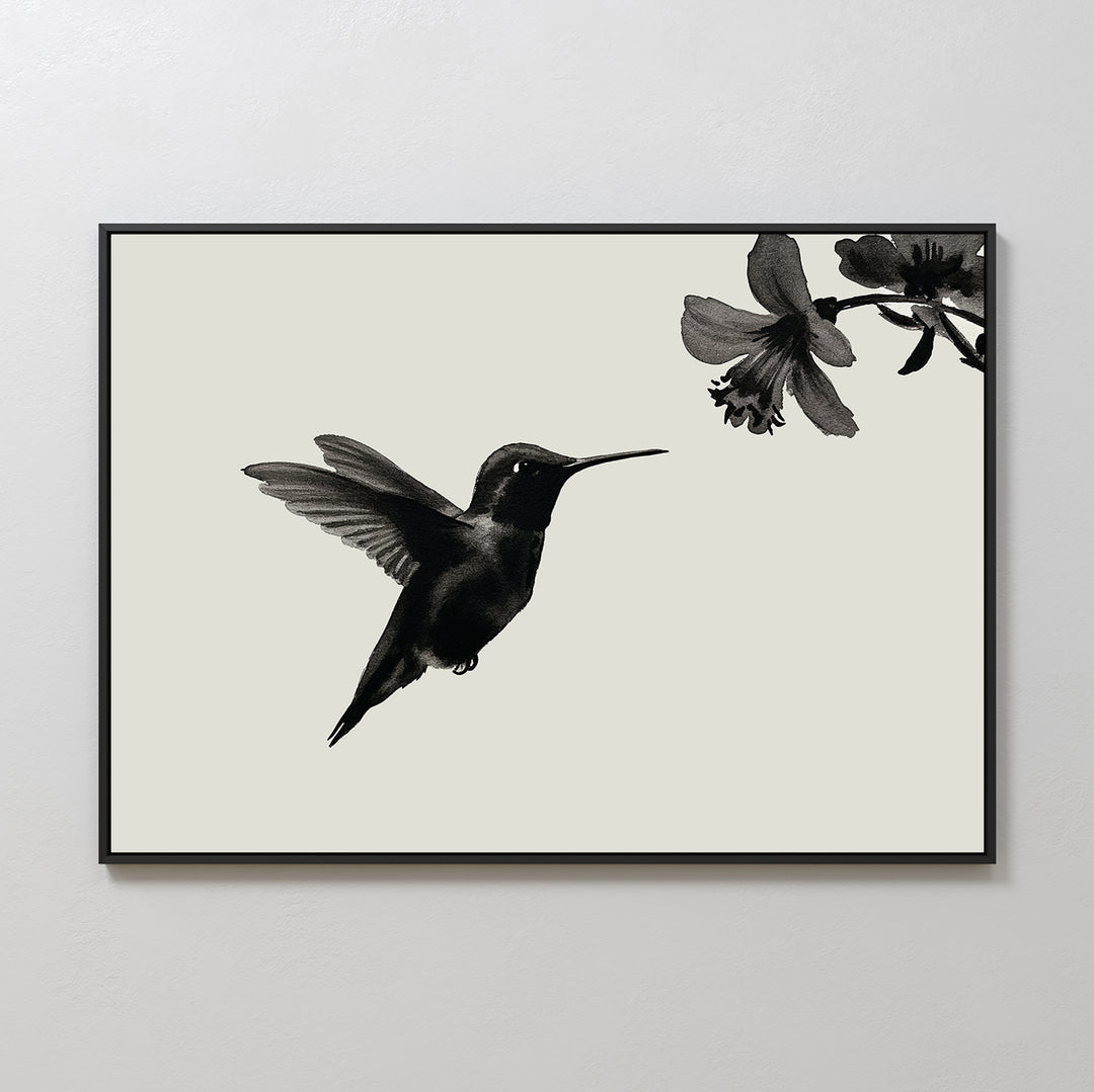 Hummingbird Motion Canvas Art: Minimalist wall decor showcasing a black hummingbird near a flower on a light background, framed with a sleek black border—ideal for modern spaces.